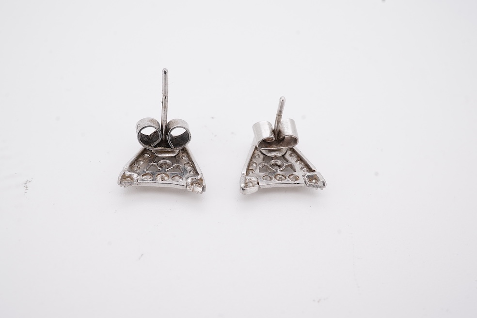 A pair of mid 20th century white metal and millegrain set diamond cluster set 'A' shaped ear studs(adapted from watch lugs?), set with round and baguette cut stones, 12mm, gross weight 3.2 grams.